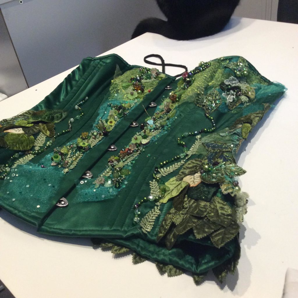 Green beaded corset by Suzanne Forbes