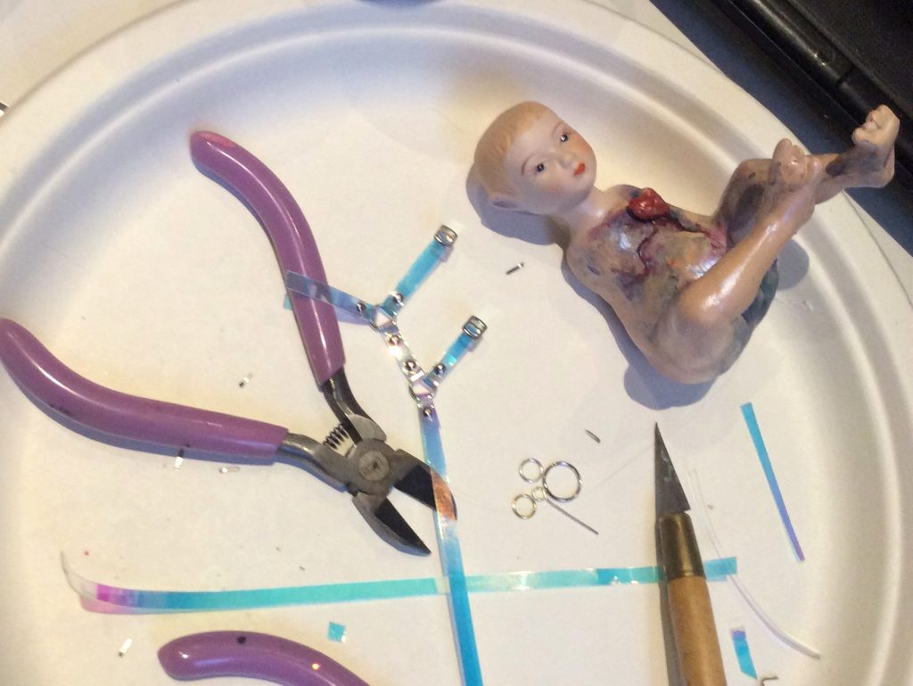 holographic pvc fetish harness for OOAK fairy in process by Suzanne Forbes April 2020