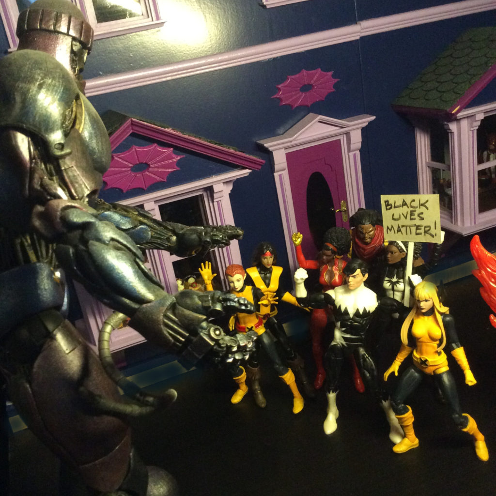 Action figure Black Lives Matter protest by Suzanne Forbes May 31 2020 allies use white skin to protect black protesters