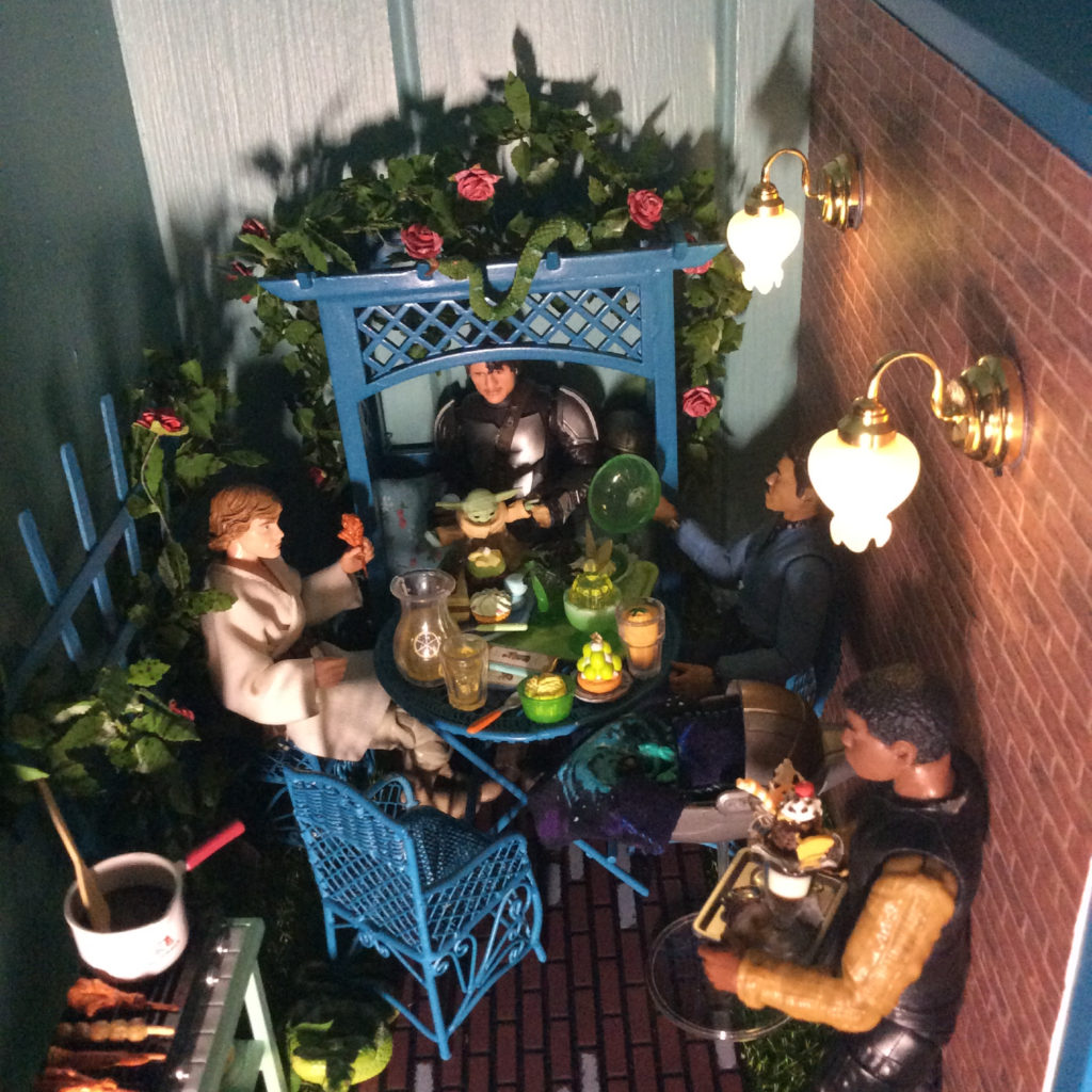 Baby Yoda and Din Djarin miniature patio scene with lights by Suzanne Forbes Feb 17 2021